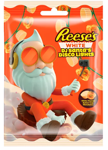 Baltojo šokolado krepšeliai su žemės riešutų kremu REESE'S WHITE DJ SANTA'S DISCO LIGHTS, 62g Baltojo šokolado krepšeliai su žemės riešutų kremu REESE'S WHITE DJ SANTA'S DISCO LIGHTS, 62g