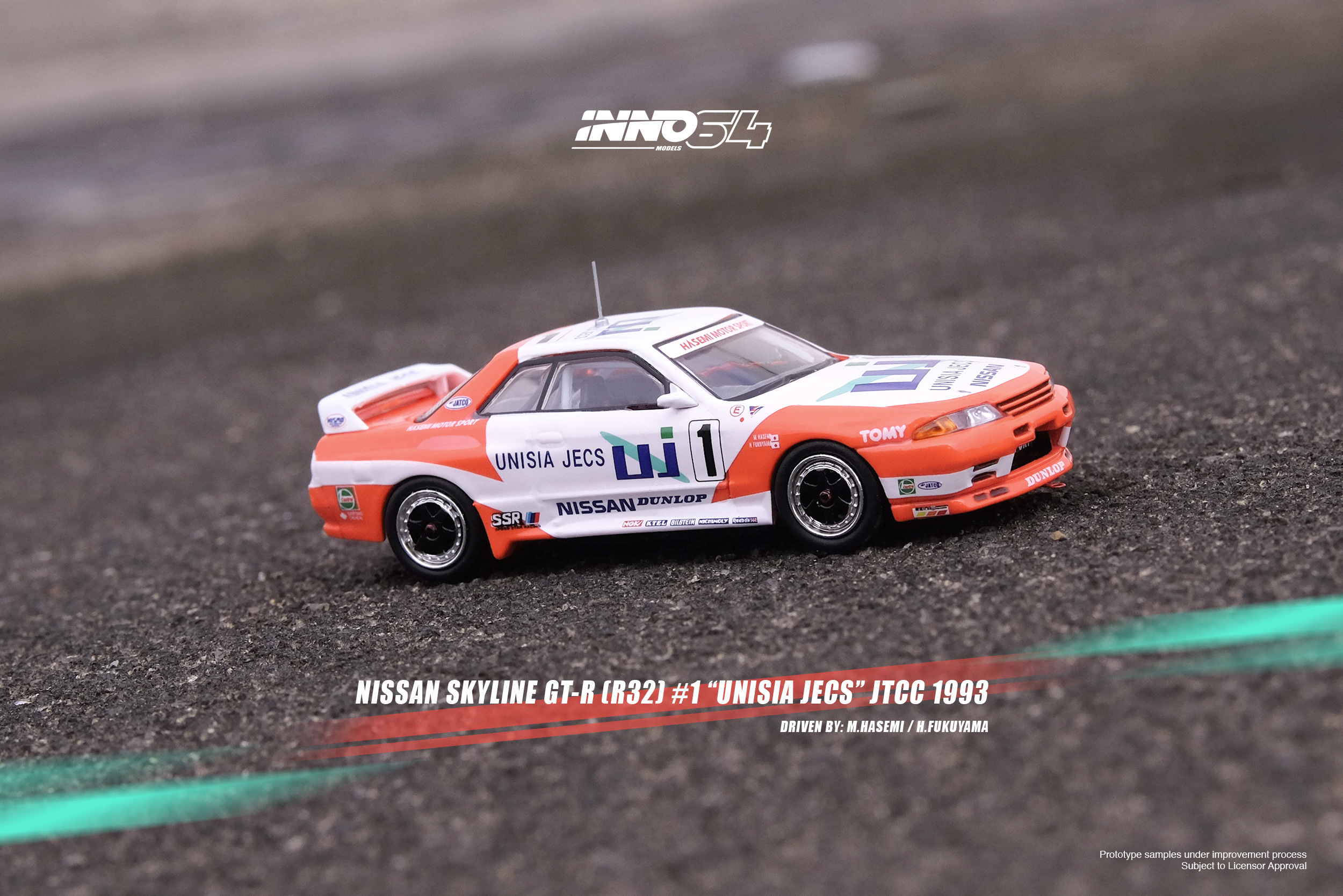 PRE-ORD3R Inno64 Modeliukas 1993 Nissan Skyline GT-R (R32) #1 M. Hasemi/H. Fukuyama *Unisia Jecs* JTCC, orange/white