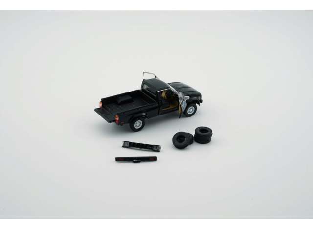 PRE-ORD3R BM Creations Modeliukas Toyota Hilux, black left hand drive with extra set of wheels and bumpers.